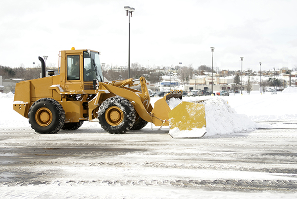 Tractor plowing snow